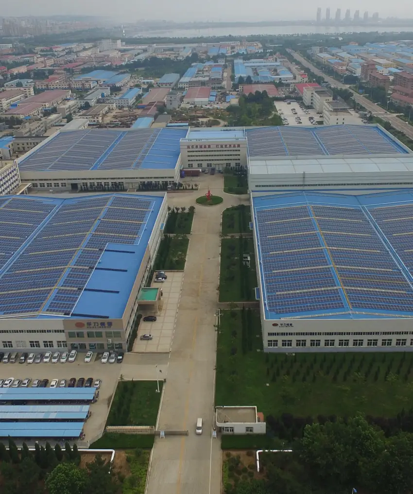 Aerial view of a large industrial rooftop solar installation